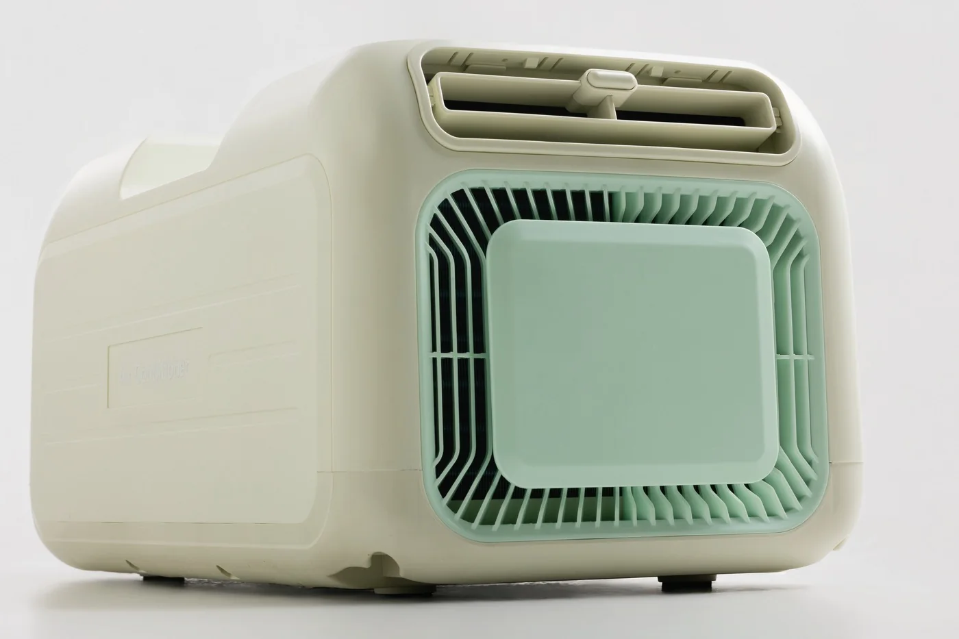 The mint intake grille and the pull-out filter panel, with the top air outlet above